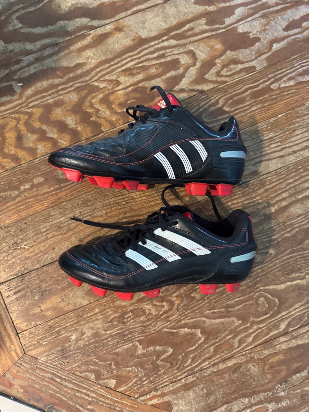 adidas  Black Soccer Cleats with White Stripes and Red cleats. Classic Adidas